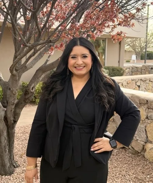 Krystal L. Chavarria smiling in an outdoor professional portrait