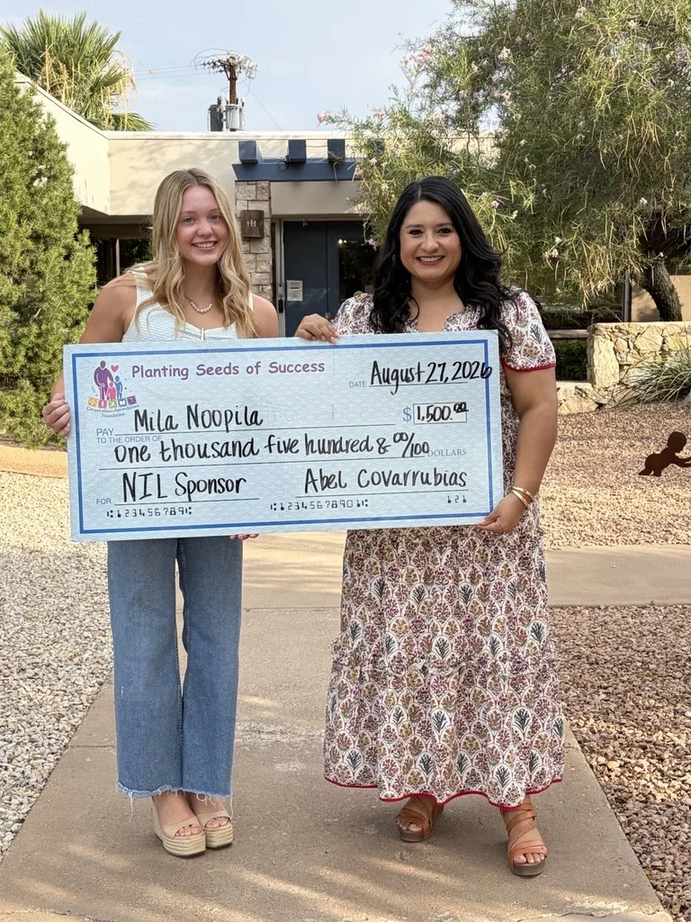 Mila Noopila and Krystal Chavarria hold a $1,500 sponsorship check from the Covarrubias-Aprendamos Foundation to support Mila's collegiate gymnastics journey.